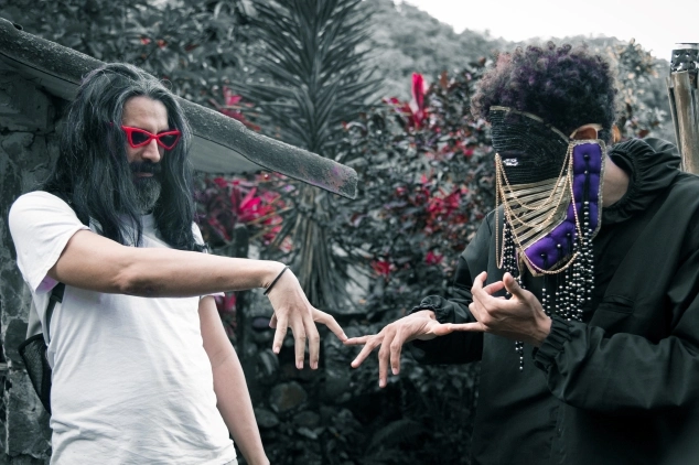 Alien tribe performing a Losaquis ritual with masks and symbolic costumes, representing alien identity, ancestral connection, and immersive electronic music experience.