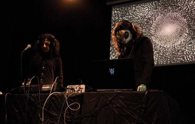 Losaquis live show at Teatro Tecal in Bogotá Colombia, featuring alien ritual performance, tribal electronic music, and immersive ancestral visuals.